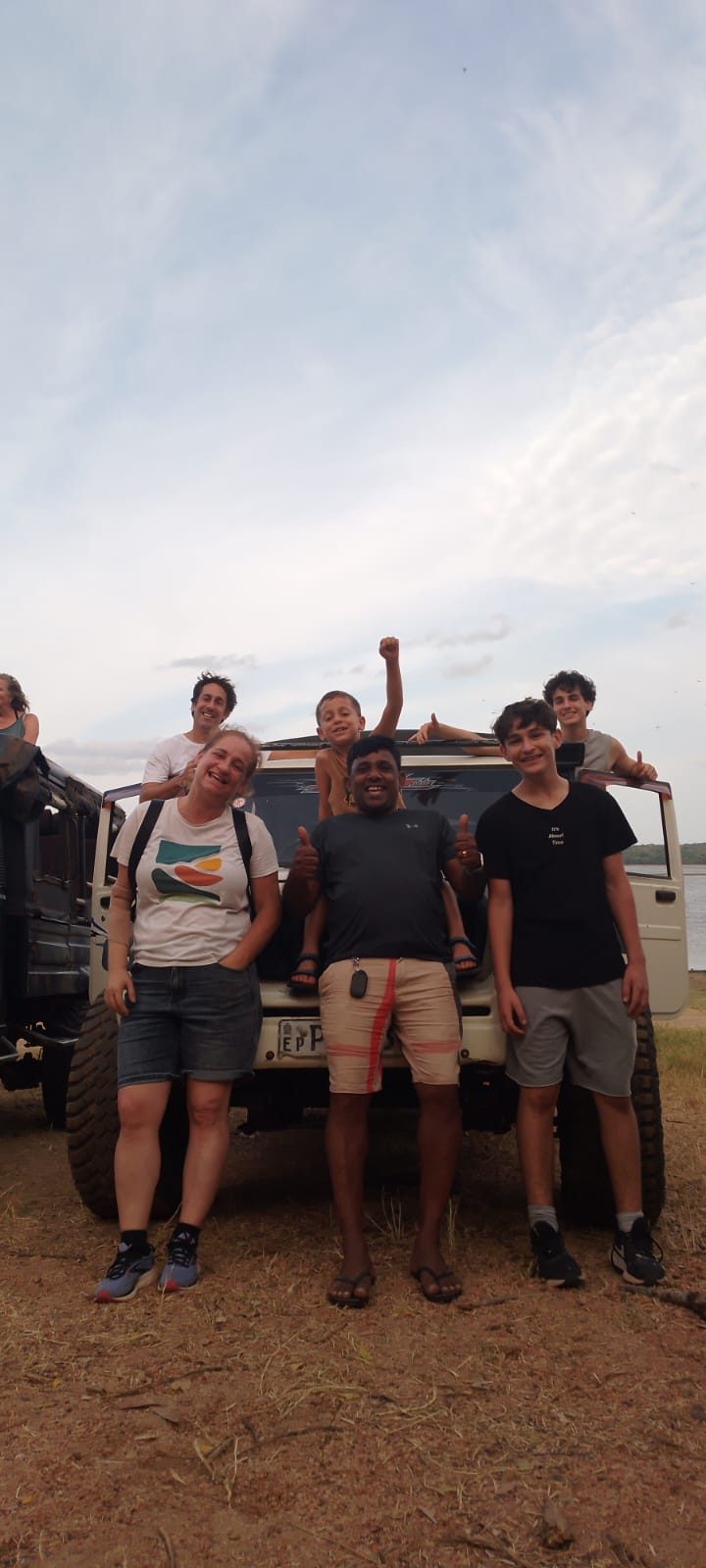 Family on a safari jeep with Chin